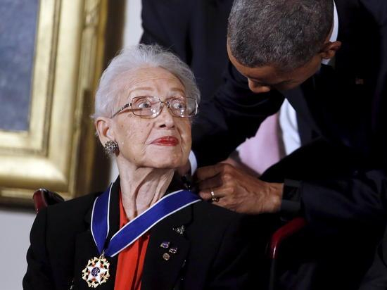 U.S. President Barack Obama presents the Presidential Medal of Freedom to NASA mathematician Katherine G. Johnson during an event in the East Room of the White House in Washington